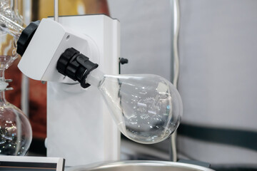 Laboratory rotary evaporator for homogenization process - chemical flask for evaporate solvent from liquid at pharmacy factory or medical exhibition. Pharma, Chemistry and science concept