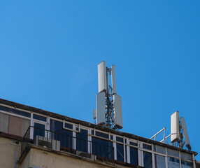 mobile communication base station, on building. telecommunication tower.