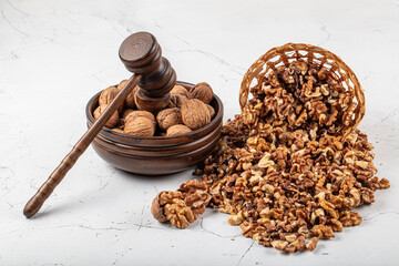 Shelled walnuts. Kernels and whole nuts on wooden rustic table, top view. Walnuts are a great...