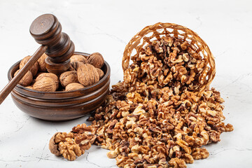 Shelled walnuts. Kernels and whole nuts on wooden rustic table, top view. Walnuts are a great...