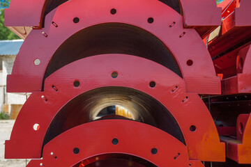 Round column panels stacked in warehouse.