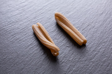 durum wheat pasta on a black slate background