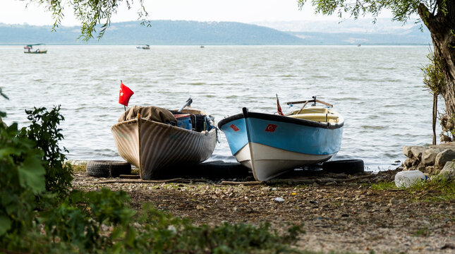 Fishing boats on the shore of Lake Apolyont. Uluabat, G&ouml;lyazı, Bursa, Turkey. Selective Focus Boat.