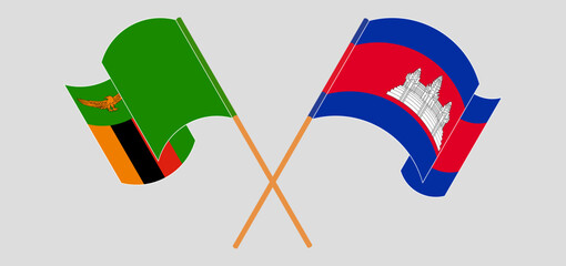 Crossed and waving flags of Zambia and Cambodia