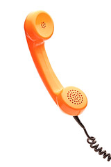 Old fashioned orange telephone hand set
