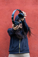 Women showing headphones