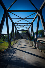 Fototapeta na wymiar pedestrian bridge under blue sky