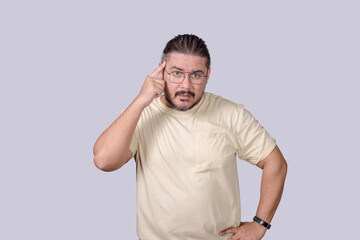 A frustrated man in his 30s harshly tells someone to use their brain. A person lecturing or chiding.