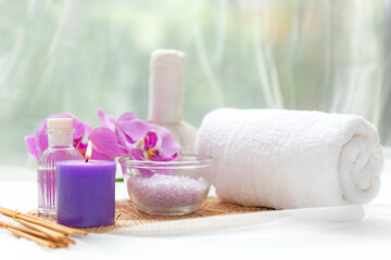 Thai Spa Treatments aroma therapy salt and nature green sugar scrub massage with orchid flower on wooden white with candle. Thailand. Healthy Concept