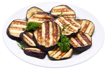 Slices of eggplant roasted on a grill with stripes from a grill isolated