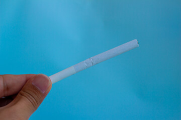 hand holding cigarette