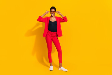 Photo of stunning butch short hair female guy touch specs wear red jacket unisex blazer isolated bright color background
