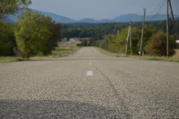 Long asphalt road in the countryside, France