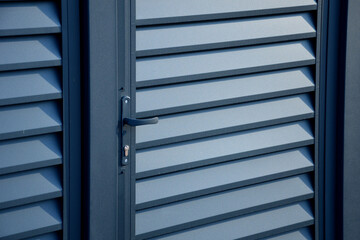 goal and ground made of metal aluminum slats. powder fired paint on door frame and fence with beveled horizontal slats