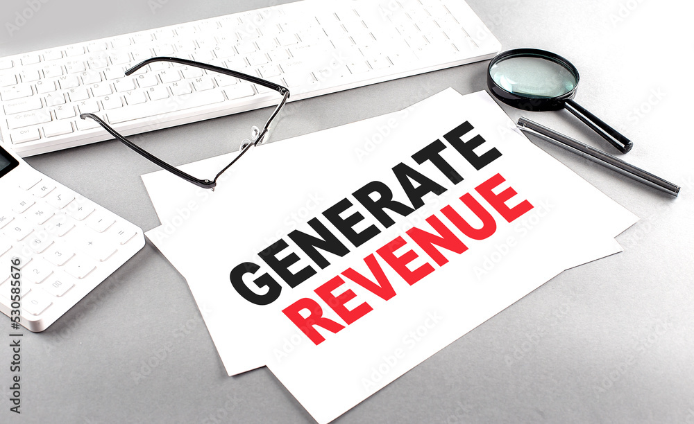 Poster generate revenue text on a paper on a gray background near a calculator and a white keyboard