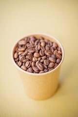 Freshly roasted coffee beans in a cup