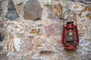 Vintage lantern lamp on stone wall