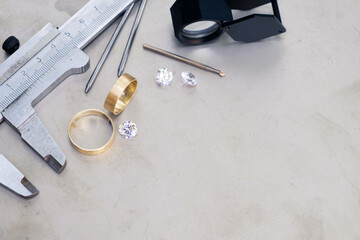 Wedding golden rings and professional jeweler equipments. Luxury diamonds