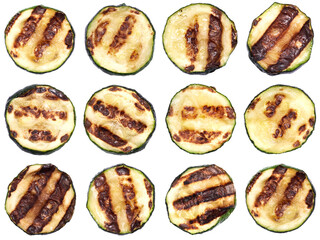 Slices of zucchini roasted on a grill with stripes from a grill isolated