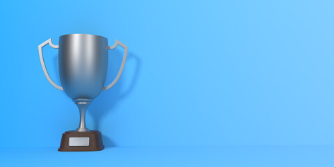 Trophy cup on blue background with copy space. Sport tournament award, silver winner cup and victory concept. 3d rendering illustration