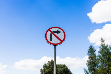 No Right Turn street sign with a cloudy sky background. Road sign don't turn right