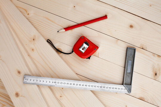 A measuring tape, a square and a pencil.