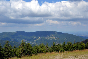 Mountain landscape. Silesian Beskids. One of the Beskids mountain ranges in Outer Western Carpathians in southern Silesian Voivodeship, Poland. Tatras peaks silhouettes in the distance