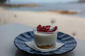 Cheesecake dessert in a cafe overlooking the ocean