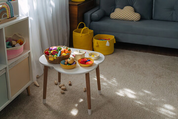 Wooden fruits and vegetables on the table in nursery. Educational games, learning through play....