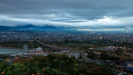 city scape at morming storm in the rainy season mountain cloud sky background in japan