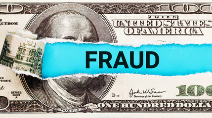Fraud word concept. Torn bills revealing Fraud words. Ideas for Election and voting rights in...
