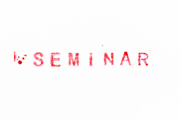 Red color ink rubber stamp in word seminar on white paper background