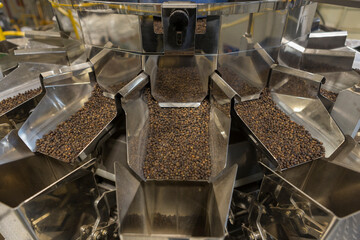 Close up detail on food packaging industrial machinery at work.