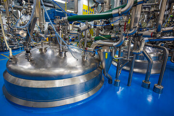 Stainless vertical steel tanks with equipment tank chemical cellar at the with stainless steel...