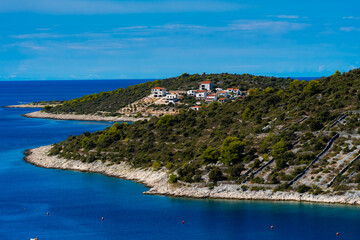 view of the coastline with a small village in the background in Sevid, Croatia