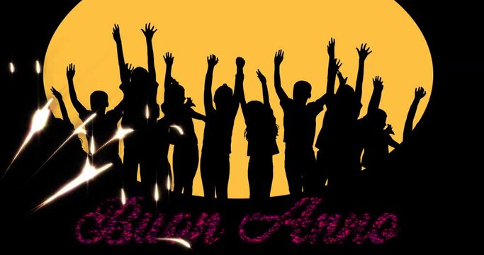 Animation of buon anno text in red with new year fireworks and silhouettes of celebrating people