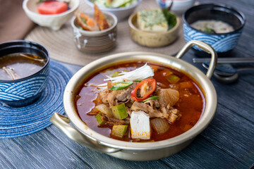 Korean traditional spicy soybean paste stew Doenjang-jjigae and various side dishes