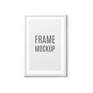 Realistic white photo frame mockup hanging on dark grey wall