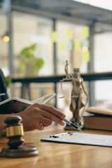 Lawyers work with hammers and scales. The goddess of justice in a consulting law firm