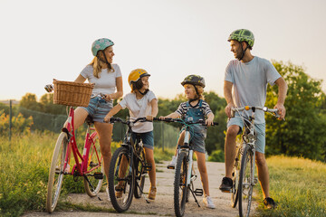 Happy family cycling together in the countryside
- 530603853