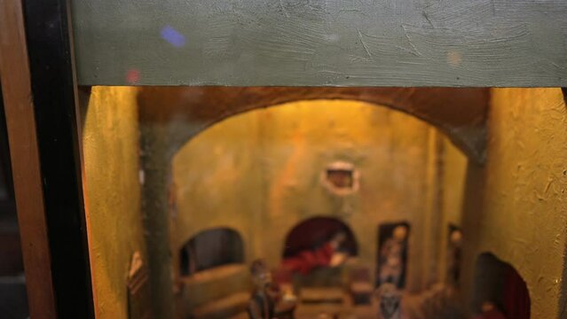 This video shows an old antique opium den diorama.