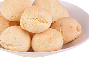 Closeup of several rolls of pan de yuca, the cheese bread made of tapioca (or yuca) flour that is very popular in Ecuador, also known as pandebono in Colombia or pao de queijo in Brazil isolated