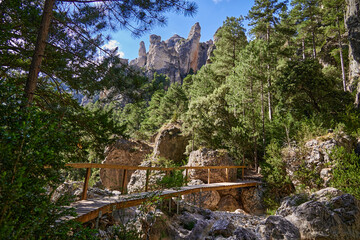 Wooden bridge over Matarrana river in front of The Parrizal Canyon in Beceite, Teruel, Spain