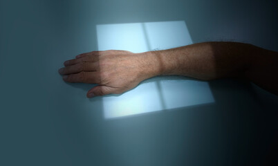X-ray hand, close-up. Patient with wrist injury during x-ray procedure in hospital