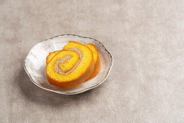 mocha roll cake (Indonesia bolu gulung moka) Bolu Gulung is a sponge cake that is baked using a shallow pan, filled with jam or butter cream and then rolled.