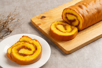 pineapple roll cake (Indonesia bolu gulung nenas) Bolu Gulung is a sponge cake that is baked using a shallow pan, filled with jam or butter cream and then rolled.