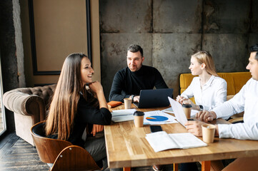 Young business team in a modern office in a relaxed atmosphere on a meeting