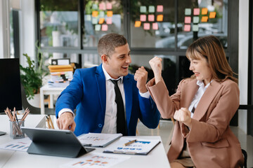 Young business team creative businesspeople coworker, teamwork celebrating achievement and in planning design in creative in office