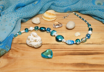 Blue chiffon scarf, nautical and blue murano glass necklaces, composition with women's jewelry,...
