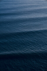 Fototapeta premium Ripples on the surface of deep blue ocean